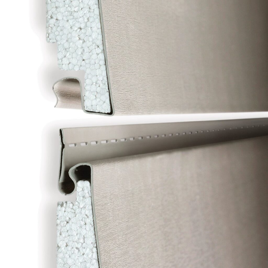Close-up view of Prodigy® insulated vinyl siding panel showcasing its thick foam insulation core and RigidLock™ design for enhanced durability, energy efficiency, and secure installation.